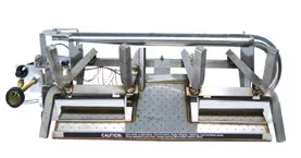 Stainless steel gas fireplace burner assembly with a control valve and grate supports on a white background.