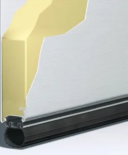 Cross-section of an insulated garage door. The top is yellow foam, the door is white, and there's a…