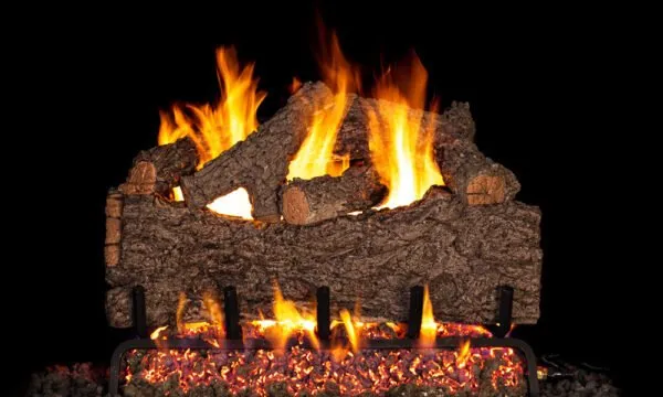 Fireplace with burning logs, flames, and a dark background.
