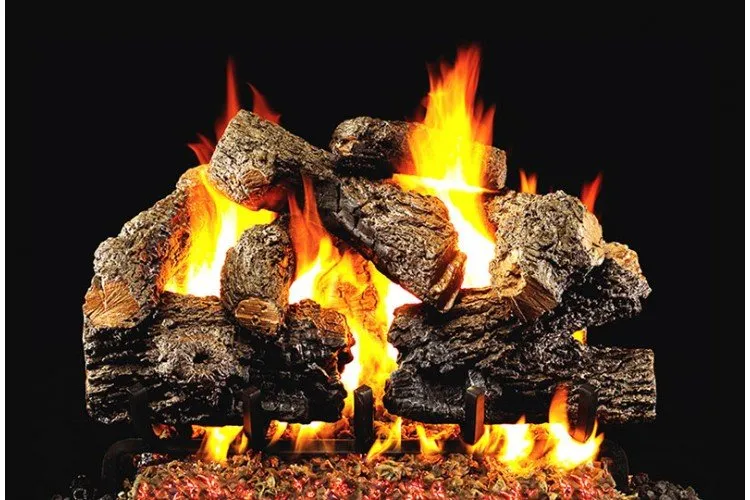 Burning gas fireplace with ceramic logs. Flames in orange and yellow against a black background.