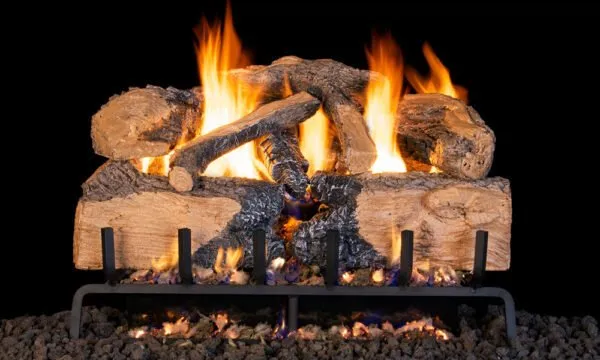Burning gas fireplace logs with bright orange flames.