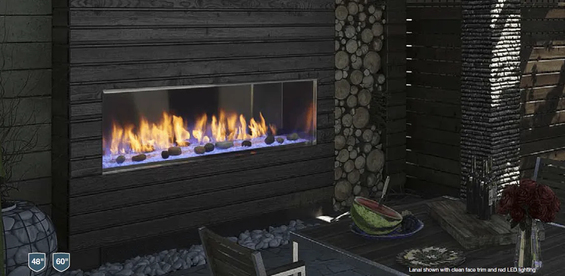An outdoor fireplace with flames, a table with food, and a decorative log wall.