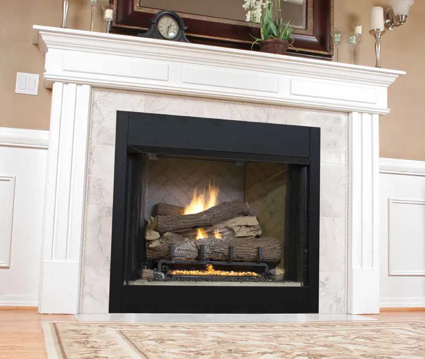 A lit gas fireplace with a black metal surround, set in a white wood mantel with marble tile