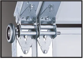 Metal hinges and a roller track assembly attached to the edge of a sectional garage door panel.